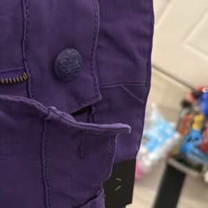 Purple capris with a button front two back pockets